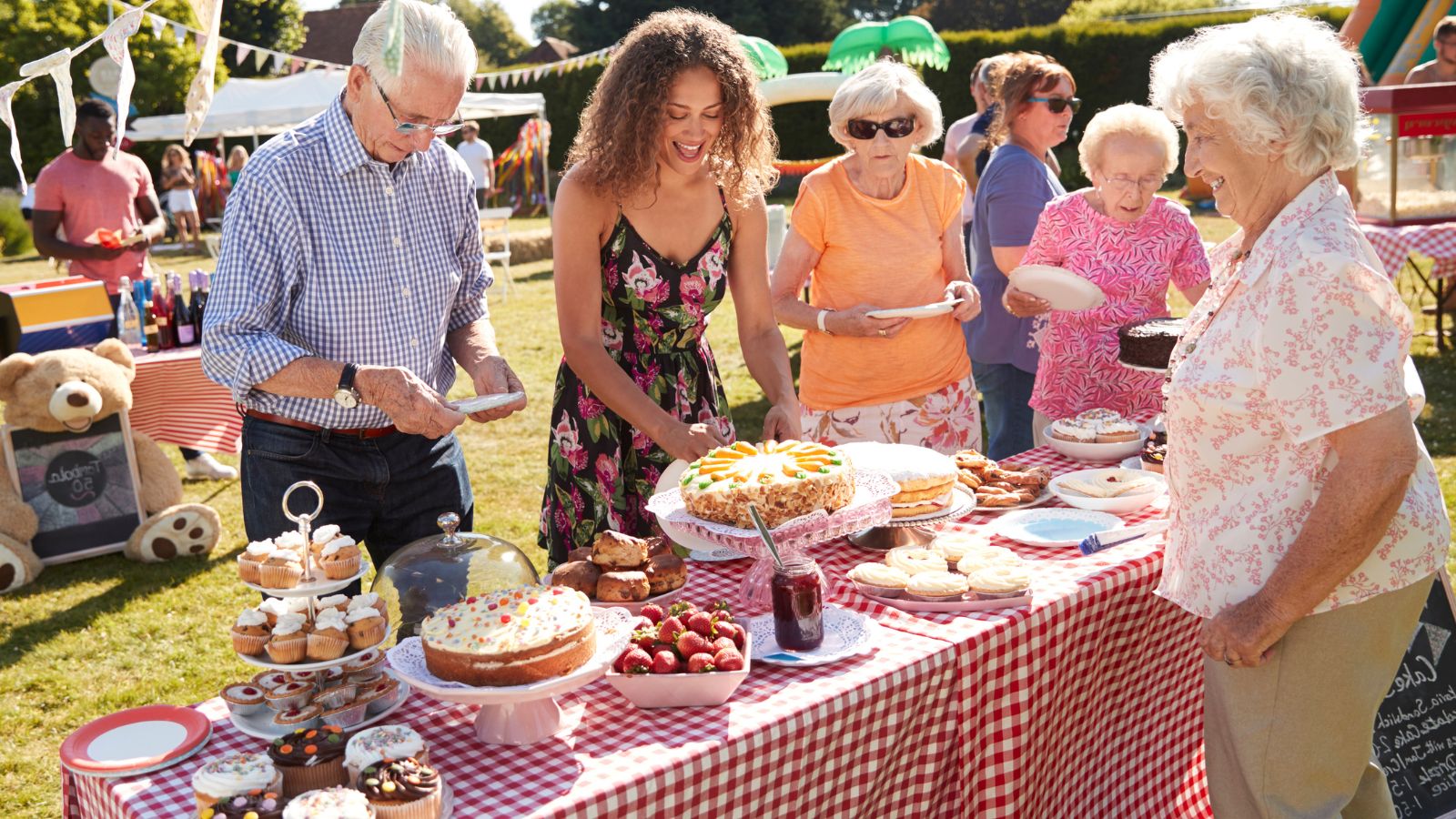 People at a summer fete cake sale